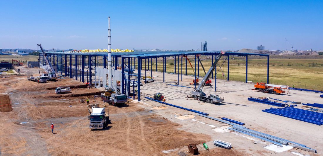 A construction site filled with industrial equipment.